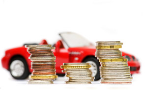 Stacked coins with red car