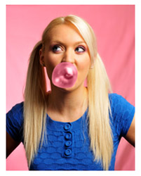 Blonde girl blowing a bubble