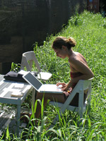 Woman outside on her laptop