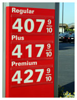 A sign with gas prices over $4 a gallon