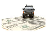 A toy model Jeep sitting on $100 bills