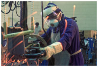 Worker in an auto factory