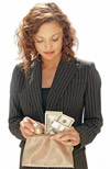A woman pulling money out of her purse