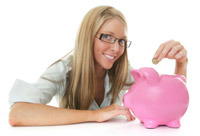 A woman adding change to her piggy bank