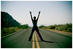 Man straddling the middle of the road