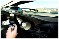 A man texting while driving