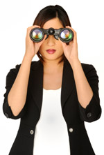 A woman with binoculars